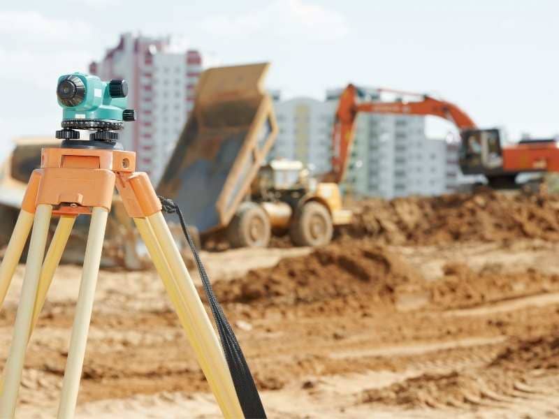 Topographic survey equipment on a redevelopment site showing elevation planning and existing ground conditions in St Louis Missouri